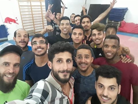 This image has an empty alt attribute; its file name is Libya-indoors-with-guys-5.jpg